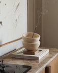Globe incense holder in beige travertine stone, PACU STUDIOS