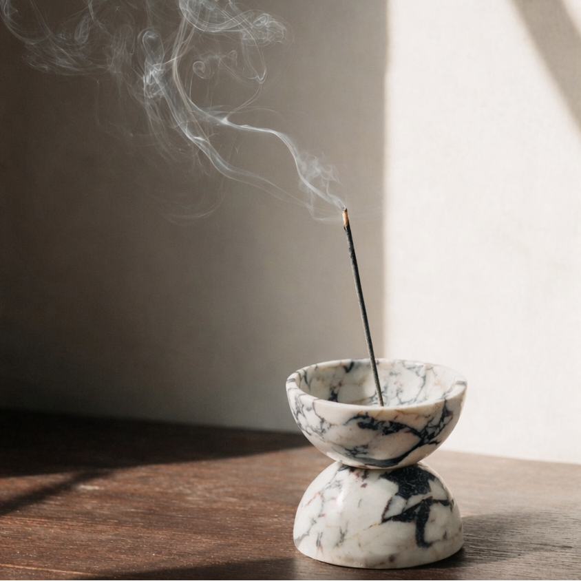 Globe incense holder in Calacatta Viola marble with purple veining
