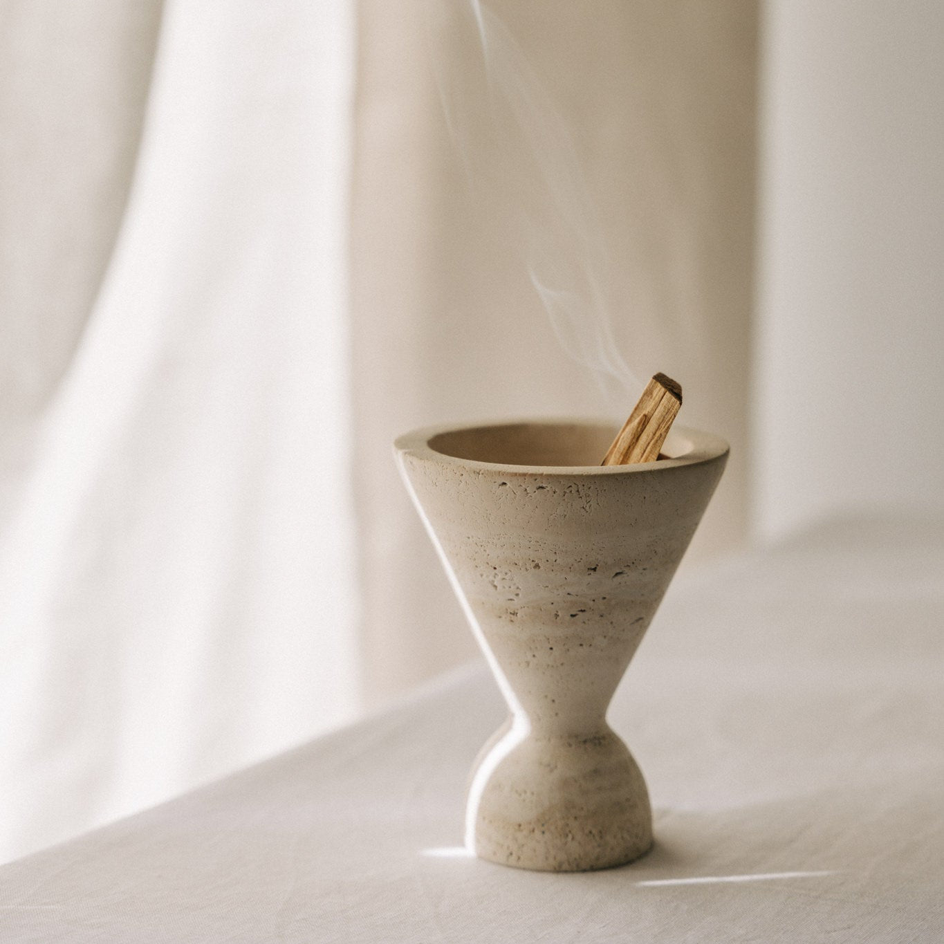 Cone incense holder in solid travertine stone, PACU STUDIOS
