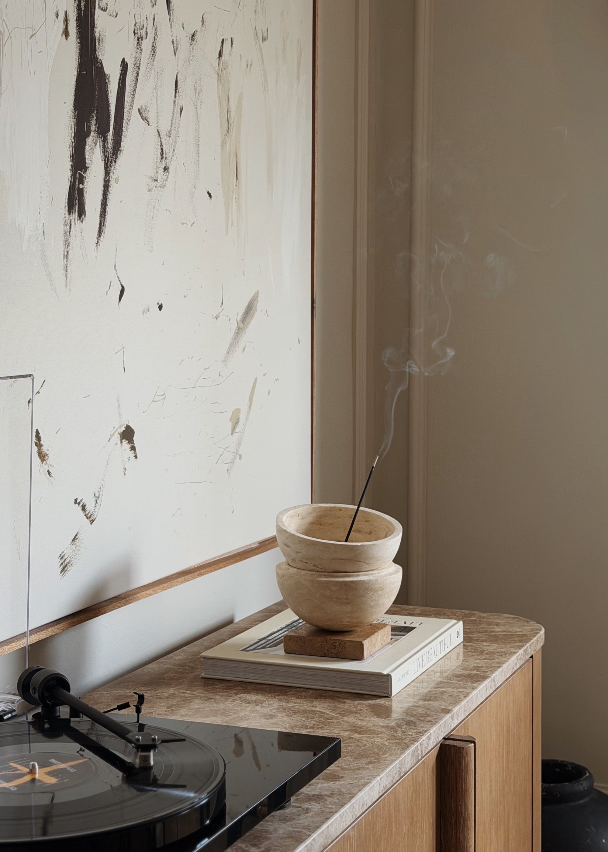 Globe incense holder in beige travertine stone, PACU STUDIOS
