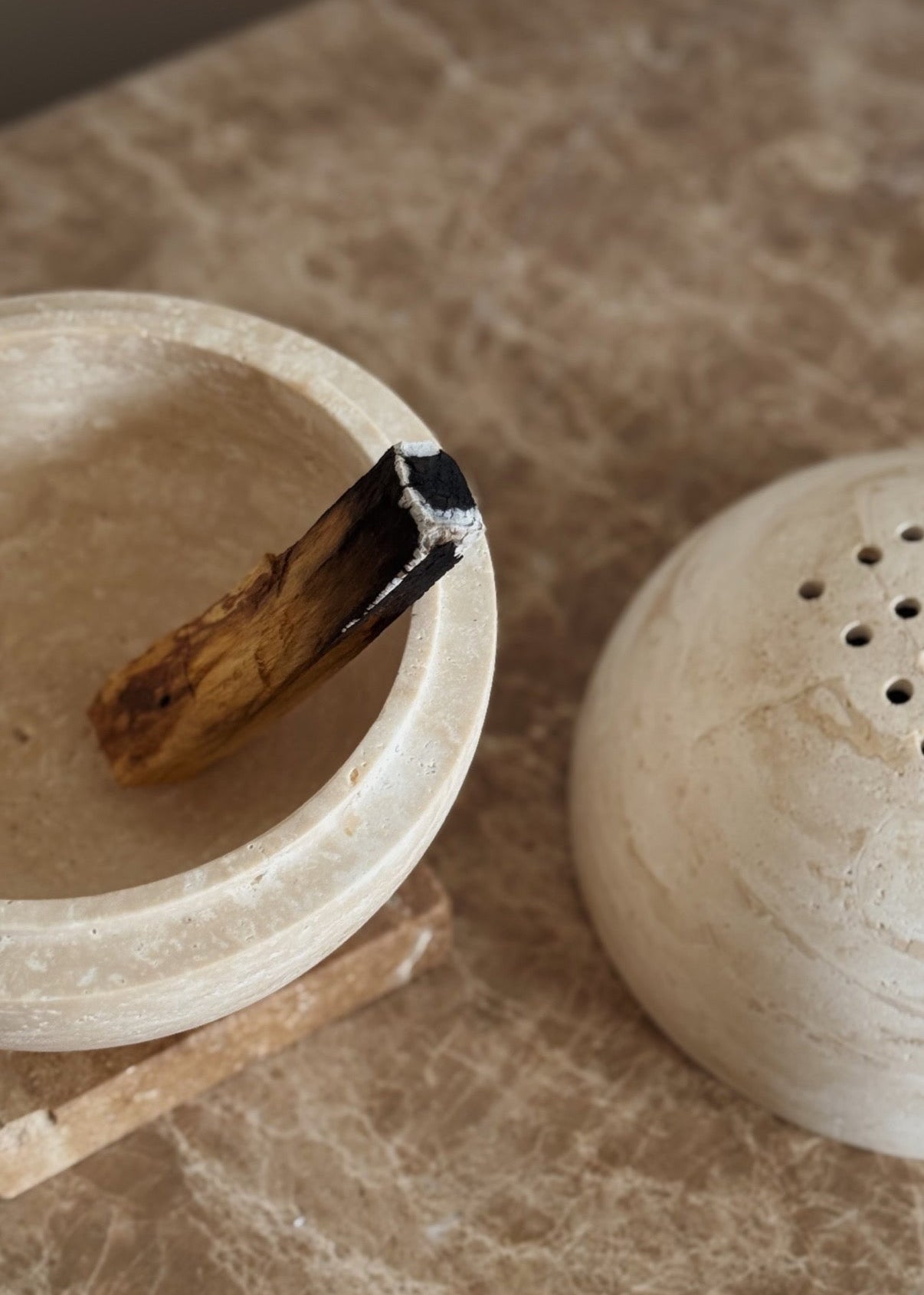Globe incense holder in beige travertine stone, PACU STUDIOS
