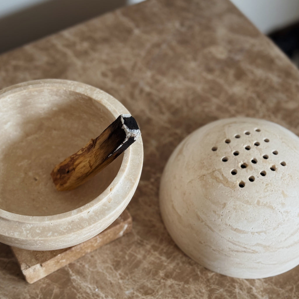 Globe incense holder in beige travertine stone, PACU STUDIOS
