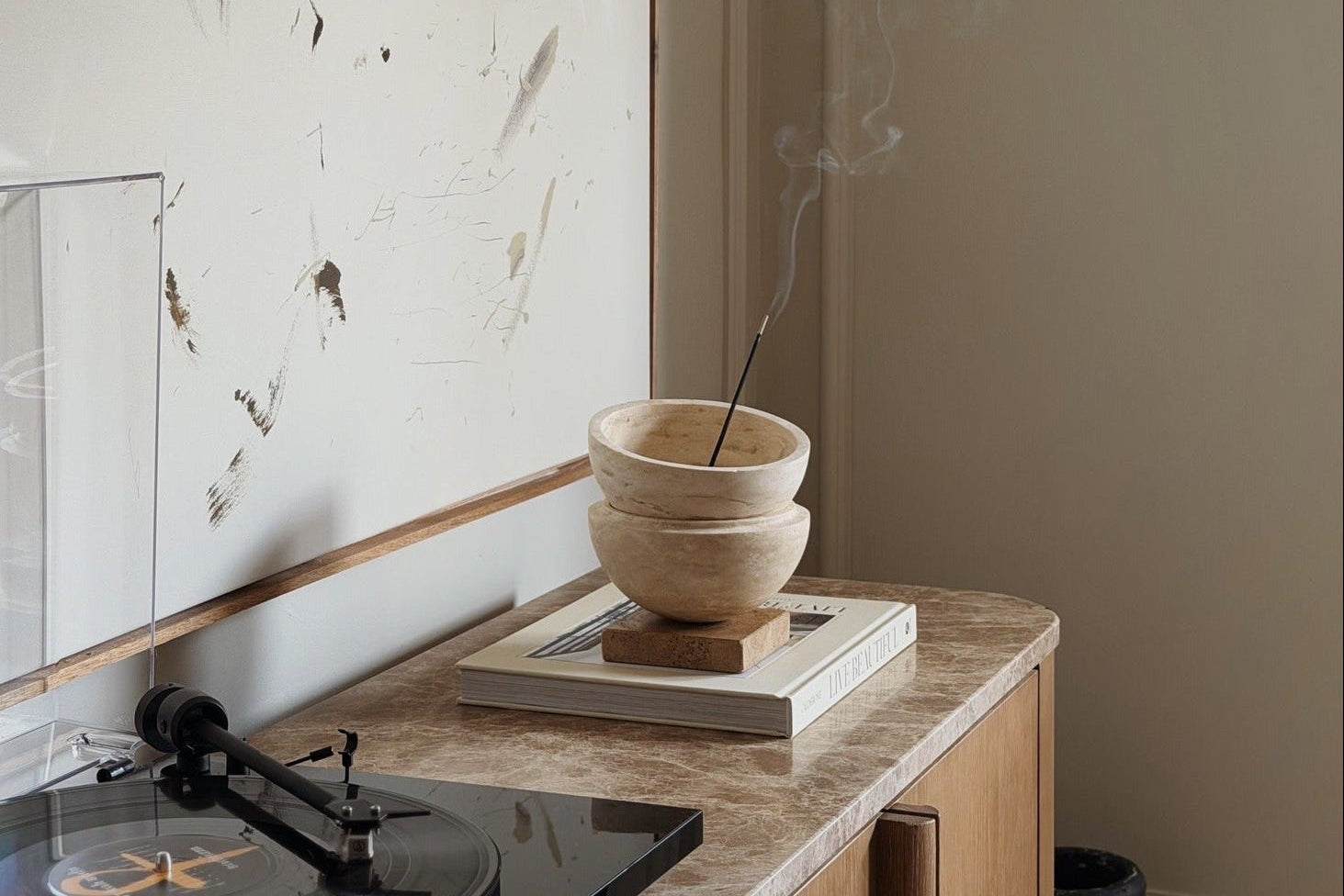 Globe incense holder in beige travertine stone, PACU STUDIOS
