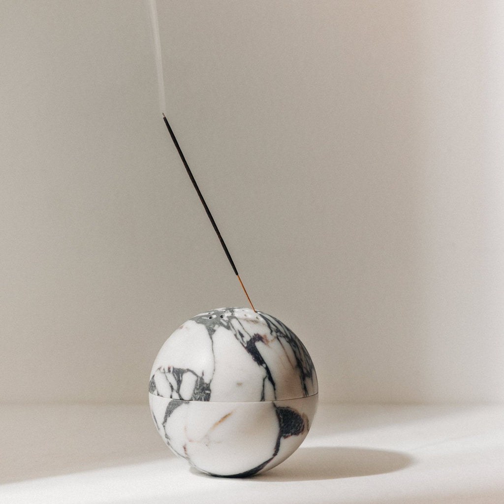 Globe incense sphere in Calacatta Viola marble with purple veining
