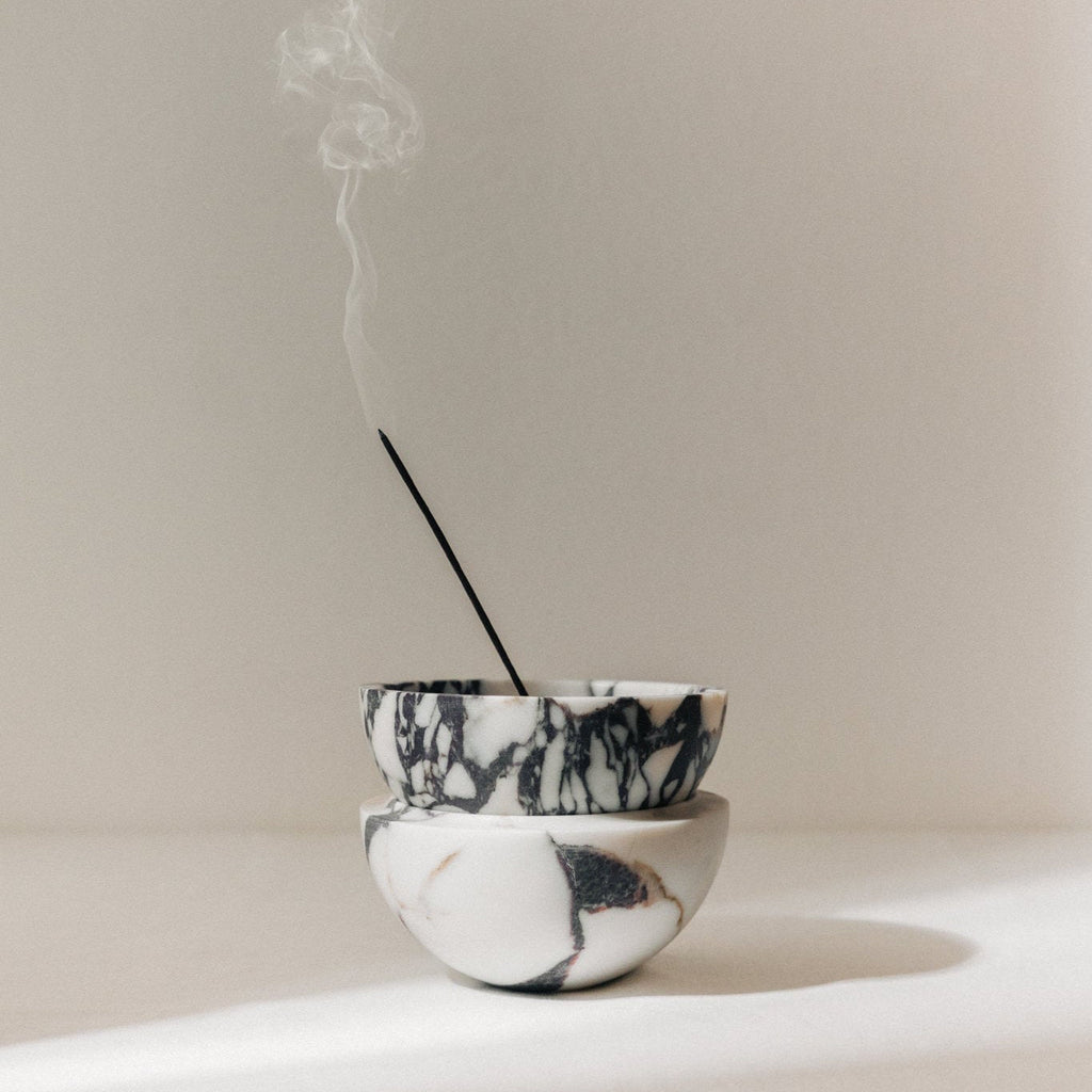 Globe incense holder in Calacatta Viola marble with purple veining
