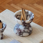 Globe incense holder in Calacatta Viola marble with purple veining
