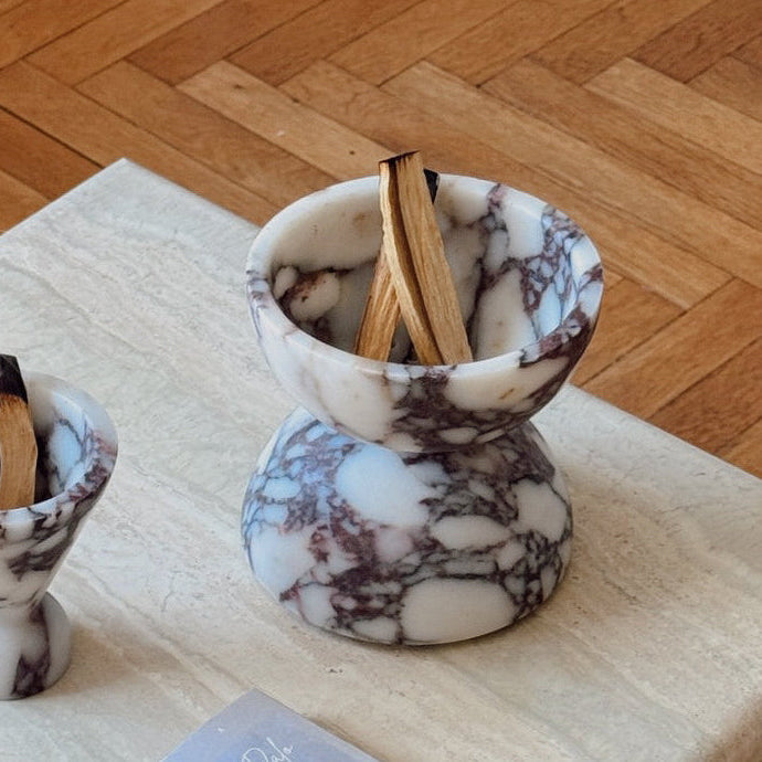 Globe incense holder in Calacatta Viola marble with purple veining
